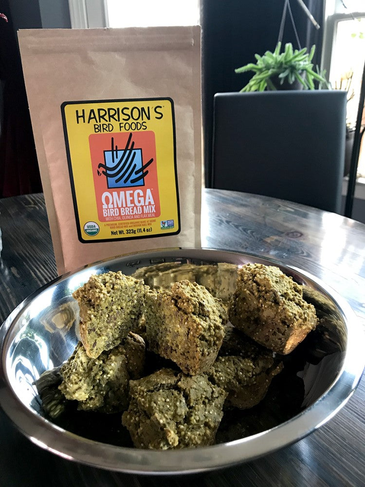 A bag of Omega Harrison's Bird Bread next to a metal bowl full of cakes made from the mix